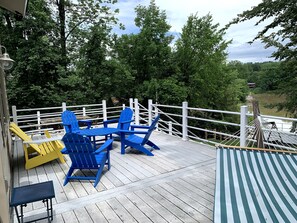 upper back deck: hammock, adirondack seating, outdoor dining for 8, gas grill