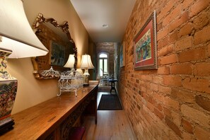 Entrance to loft with Antique Buddhist prayer table. 