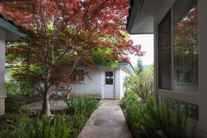 View of front courtyard to private garage looking from front door.