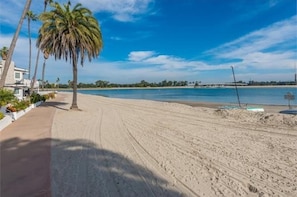 Stroll out your front door to walk along the soft sandy beach.