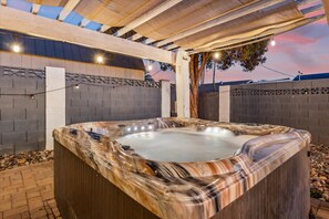 Hot tub fits 7 people. Heats year-round up to 104 degrees Fahrenheit.