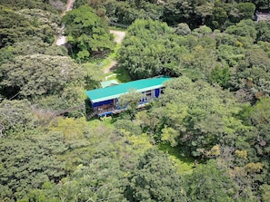 View from the top of the house. Parking and green area now with balcony.