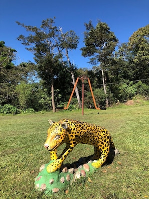 Seesaw game and statues of different animals in the private entertainment park. 