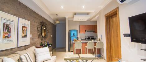 The comfortable living room comes with an Open fully equipped Kitchen, Balcony w