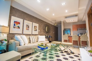 The comfortable living room comes with an Open fully equipped Kitchen, Balcony w