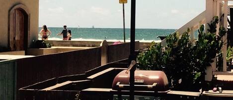 Sit down ocean / beach / boardwalk views from community patio. 