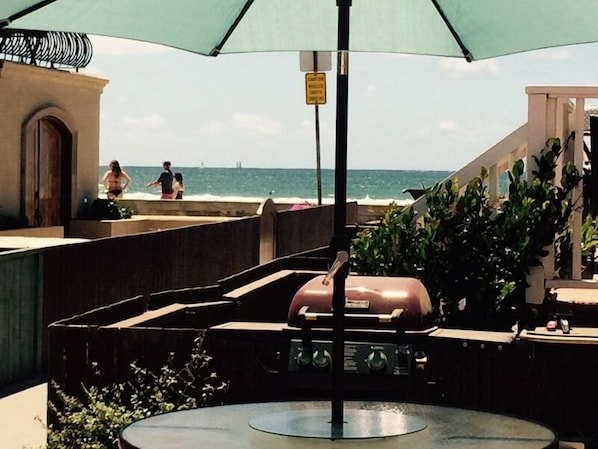 Sit down ocean / beach / boardwalk views from community patio. 