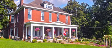 Front of the mansion on a beautiful summer day