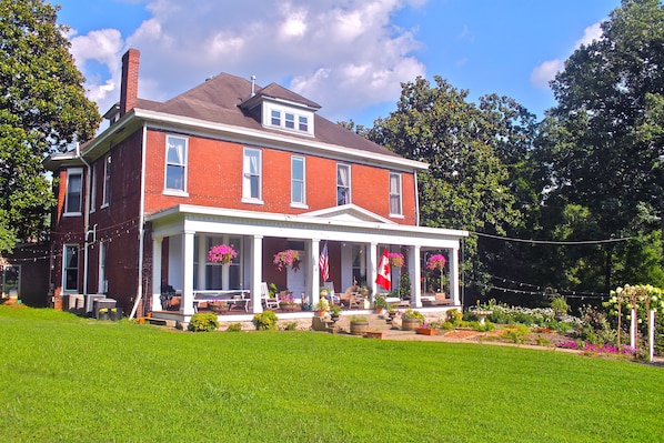 Front of the mansion on a beautiful summer day