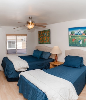 Cozy bedroom shows new beds with addition of twin bed. 