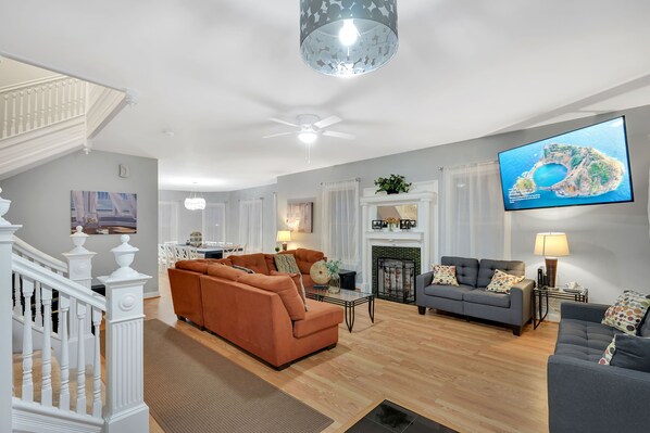living room  with 70 inch screen and 240 channels 