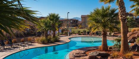 Two-tier pool with rock water slide and large hot tub