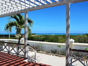 The ocean view from the very large balcony of a two bedroom (plus loft) villa