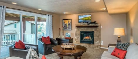 Basement Family Room with fireplace and deck access