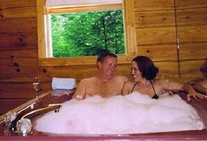 Large two person Jacuzzi by the fireplace