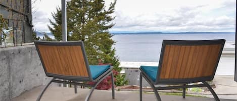 Enjoy the expansive unobstructed ocean and mountain views from your private deck