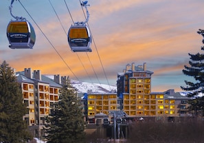 Gondola comes right to your door, connects with another lift.   Ski/boot valet!