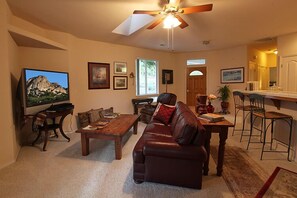 Living room, large screen t.v., dish w/hopper.  Light and bright.