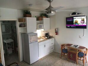 Small kitchen, dining table and 2 chairs.