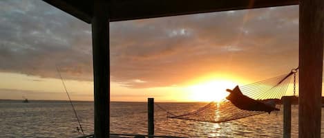 The dock faces due south, so you get both sunrises & sunsets over the water!