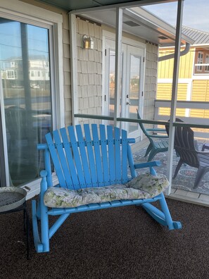 Even before you enter thru the front door, choose a seat on the porch-Rocker...