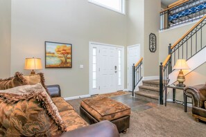 Great room seating area open to upper floor