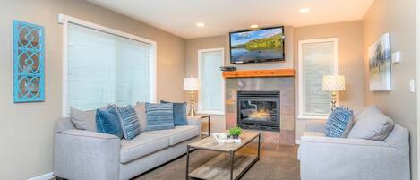 Living Room with comfortable sofas, fireplace and TV