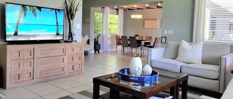 Spacious living room opens up to dining room. 