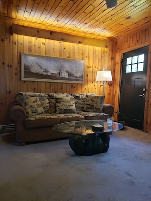 Living room with wood burning fireplace