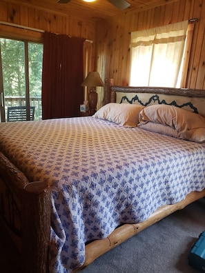 Master bedroom with deck, log post bed and bath