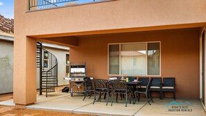 Poolside covered patio for barbecues and relaxation together