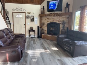Main Floor Living Room with Wood-Burning Fireplace