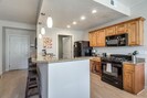 This condo has a very open, modern floor plan that lets families or work colleagues spend time together