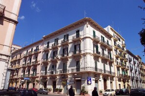 building exterior in the sun, the apartment is on the first floor