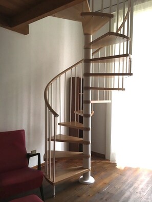 Stairs to the double bedroom on the wooden loft