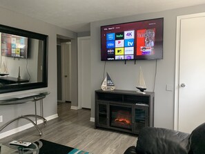 55” 4K UHD Smart TV with Directv programming and an electric fireplace 