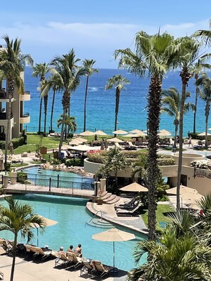 Spectacular grounds with beach entry pool, swim-up bars & views, views, views!