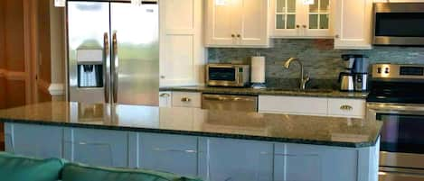 Large, bright kitchen with counter seating