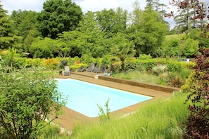 pool , decking & landscaped garden