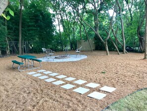Beautiful gravel backyard with fire pit
