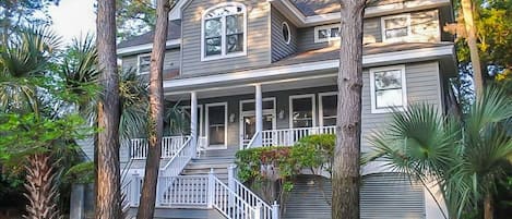 Front of the house. Front porch has rocking chairs.