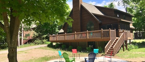 Front of house with large in-ground firepit.