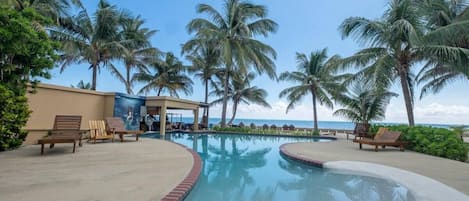 Great pool with swim-up bar. Cocktails in the pool with the Ocean as your view