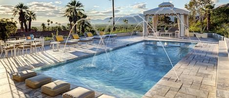 Dramatic water feature, water shelves accent the area by the spa and cabana.