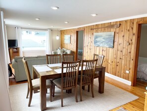 Dining room and living room with doors on right leading to bedrooms #1 and #2 