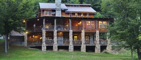 Rustic Antique Lumber Log Cabin with 2 stories of wrap around porches.