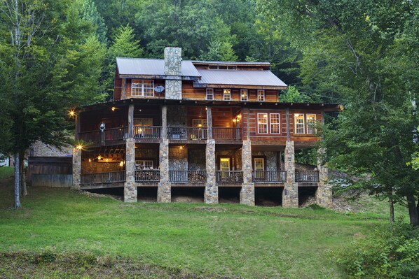 Rustic Antique Lumber Log Cabin with 2 stories of wrap around porches.