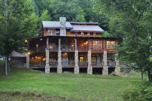 Rustic Antique Lumber Log Cabin with 2 stories of wrap around porches.