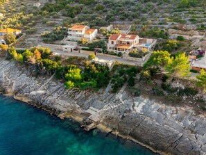 Water, Plant, Building, Natural Landscape, Tree, House, Coastal And Oceanic Landforms, Bank, Landscape