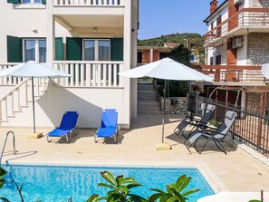 Building, Property, Furniture, Plant, Window, Azure, Shade, Outdoor Furniture, Chair, Leisure